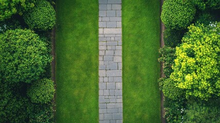 Aerial view of stone path between green hedges.