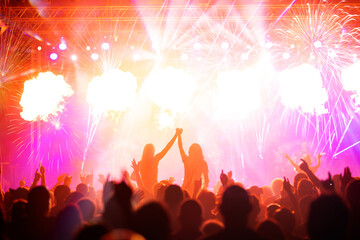 New Year concept - cheering crowd and fireworks