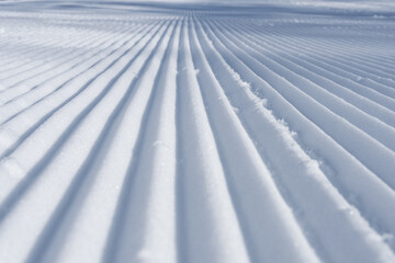 Preparations for the start of the ski season, grooming the pistes for skiers.