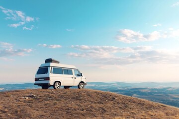 Obraz premium Campervan on Scenic Hilltop Adventure with Vast Mountain Landscape