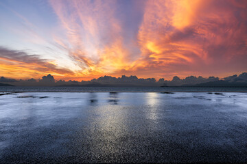 Asphalt road square and beautiful coastline with sky clouds natural landscape at dusk. Outdoor road background.