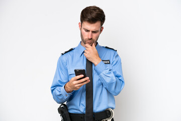 Young police caucasian man isolated on white background thinking and sending a message
