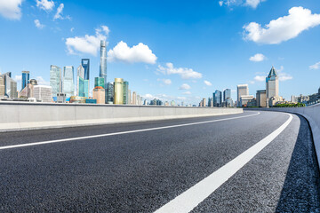 Asphalt highway road with modern city buildings scenery in Shanghai, China. Outdoor city background.