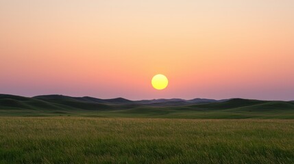Fototapeta premium A tranquil sunset over rolling hills, casting warm hues across the sky, creating a serene atmosphere in a vast open landscape.