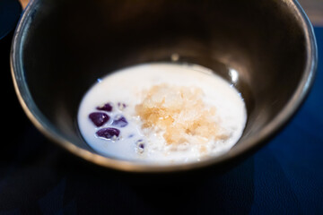Thai glutinous rice balls with coconut milk.