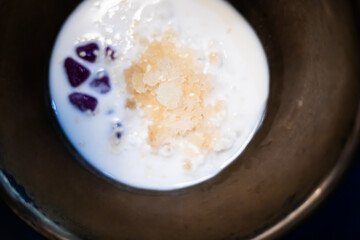 Thai glutinous rice balls with coconut milk.