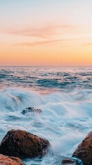 Obraz premium Waves Crashing on Rocky Shore at Sunset Photography Coastal Landscape Serene Environment