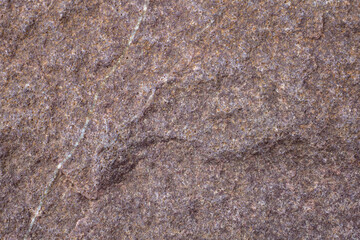 Brown stone background, natural stone texture, stone surface close-up.