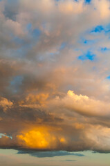Sunset sky landscape, colorful sunset sky clouds lit by evening sunlight. Vast sunset sky landscape panoramic view