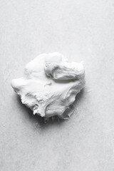 fondant or gumpaste for decorating cake on a white marble countertop, making white fondant on a marble surface