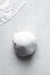 white fondant, gumpaste or sugarpaste on a marble countertop