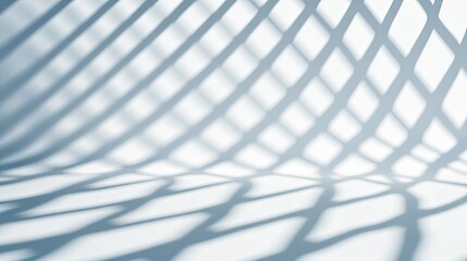 Naklejka premium Intricate Play of Light and Shadow From a Twisted Wire Structure on a Smooth White Surface
