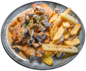 chicken schnitzel with fresh mushrooms and french fries isolated on a plate