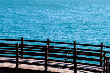 fishing rod on the wooden observatory at the seaside