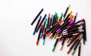 Markers Scattered on White Background