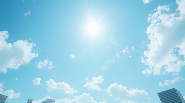 Sunny Day Sky with Clouds: A breathtaking view of a bright blue sky, punctuated by fluffy white clouds and a radiant sun, casting a warm glow over the cityscape.  