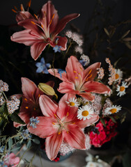 Colorful artistic still life with lily flowers, moody aesthetic