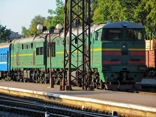 An old locomotive sits on a forgotten side track at a train station © Ivan Koliadzhyn
