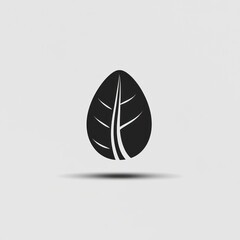 A stylized black leaf design on a white background