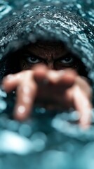 A man peeking out from under a blanket in the water
