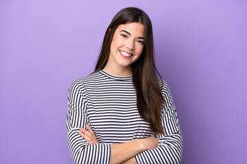 Obraz premium Young Brazilian woman isolated on purple background keeping the arms crossed in frontal position