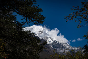 First Glimpse of Himalayan mountains seen during day 3 trek of Lama Hotel to Langtang Village, Nepal