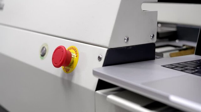 Start stop buttons. The man is pushing buttons. Start and stop. Industrial equipment setup.