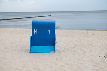 a beach chair on the sand 