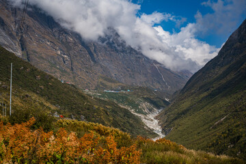 Fototapeta premium Cloudy and Foggy Mountain Peaks of Himalayas