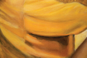 Close up painting texture, yellow oil paint on canvas