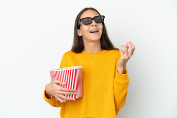 Young French girl isolated on white background with 3d glasses and holding a big bucket of popcorns