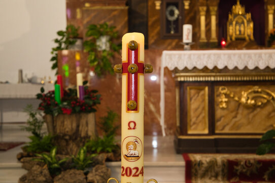 Catholic church. The Paschal candle. A new Paschal candle is blessed and lit every year at Easter.