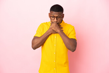 Young latin man isolated on pink background is suffering with cough and feeling bad
