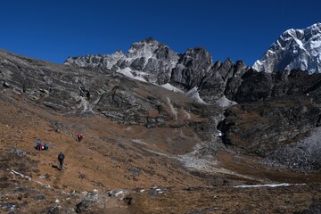 Amazing views on trekking to Kongma La Pass 5535 m with silhouettes of trekking people, from...