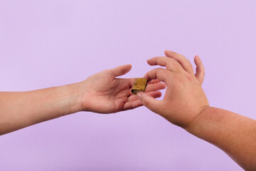 Old tiny book in hands