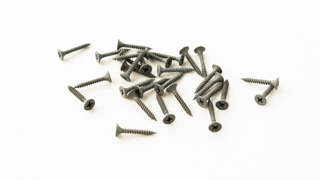 tapping screws made of steel, metal screw, iron screw, chrome screw, screws as a background, wood screw