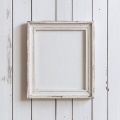 A rustic white wooden picture frame mock up with a distressed finish, mounted on a white shiplap wall, creating a vintage farmhouse aesthetic