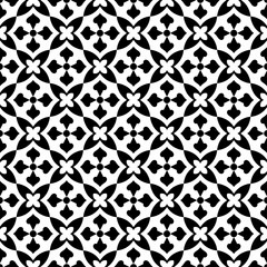 Seamless black and white geometric pattern, consisting of repeating symmetrical floral shapes. Suitable for backgrounds, wallpapers, textile designs, prints, decorative projects, etc.