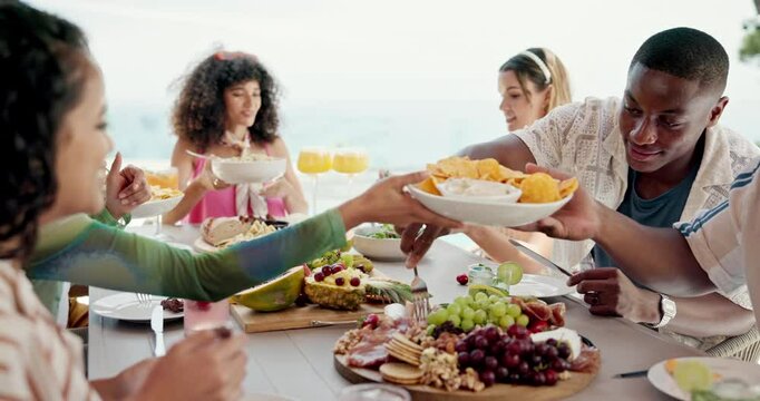 Friends, party and summer food with lunch on patio for vacation, bonding and reunion. Group of people, diversity and new years celebration with holiday and outdoors for fruits, nutrition or brunch