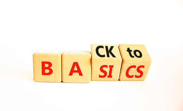 Back to basics symbol. Concept words Back to basics on wooden block. Beautiful white table white background. Business back to basics concept. Copy space.