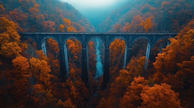 Autumnal railway bridge over a valley.