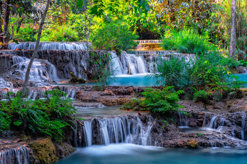 Waterfalls Kuang Si. Luang Prabang, Laos. Travel and tourism in Asia. Beautiful and largest park with cascades of waterfalls in Laos