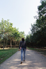 woman walking forward on the path to her intended destination and her journey along the path is a good exercise. feet walking along the path is the concept of walking to her destination and success.