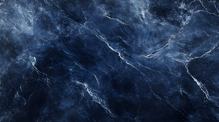 A moody sea texture depicting the rough surface of deep ocean waves with rich navy blues and streaks of foamy white.