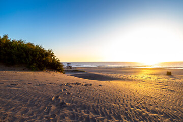Beautiful morning of summer in the beach. View of sunrise in Mar Azul, Argentina.