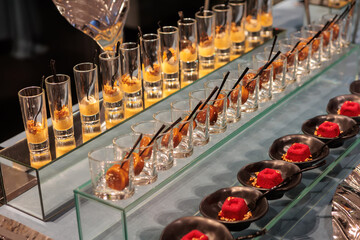 Delicious mini red velvet cakes with cream cheese frosting and grated cheese