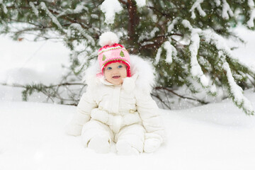 Kids play in snow in winter park