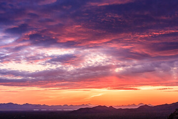 Fototapeta premium A beautiful sunset with a pink and orange sky