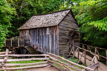 A wooden house with a wooden fence and a wooden bridge