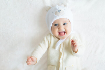 Little baby on white bed